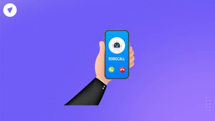 The image shows a hand holding a smartphone with an incoming call screen displaying "ROBOCALL" along with a robot icon. The background is a gradient purple, and the phone screen has green (answer) and red (decline) buttons. This illustration suggests an unwanted or fraudulent call, often labeled as "scam likely."